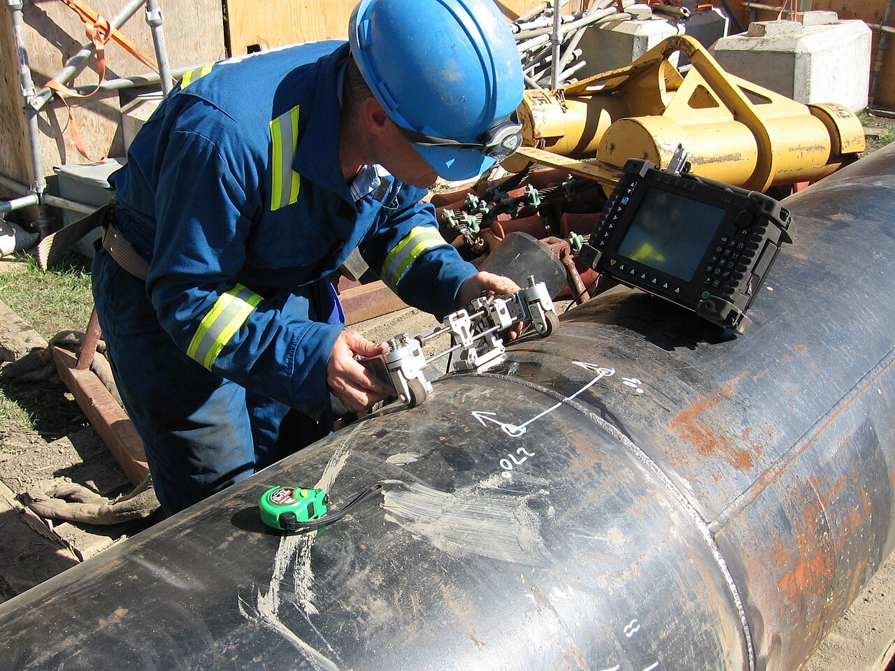 Technician performing phased-array ultrasonic inspection