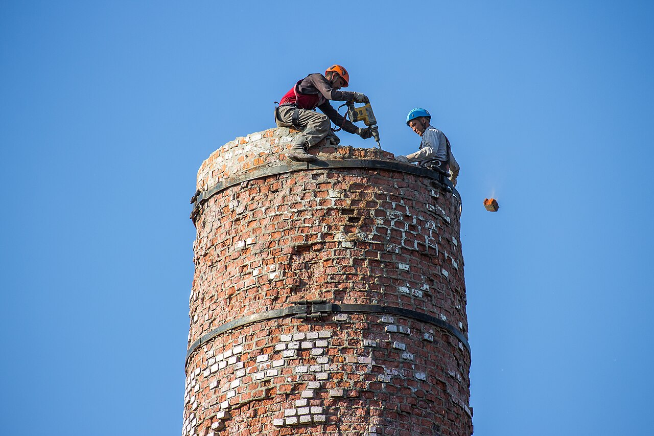 Technicians working at height on a tall structure