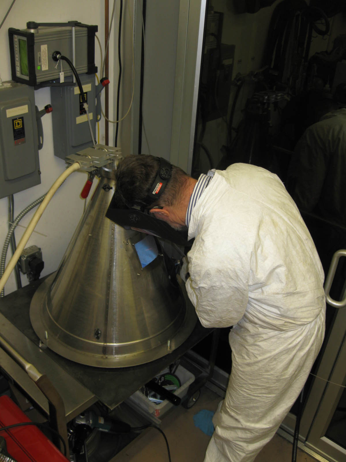 Inspector examining process equipment